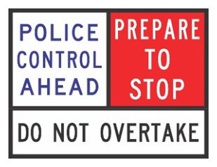 Figure 4.8.2(a) – Police performing traffic control duties, PREPARE TO STOP sign (not at