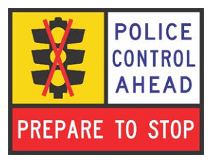 Figure 4.8.2(b) – Police performing traffic control duties, PREPARE TO STOP sign at signals